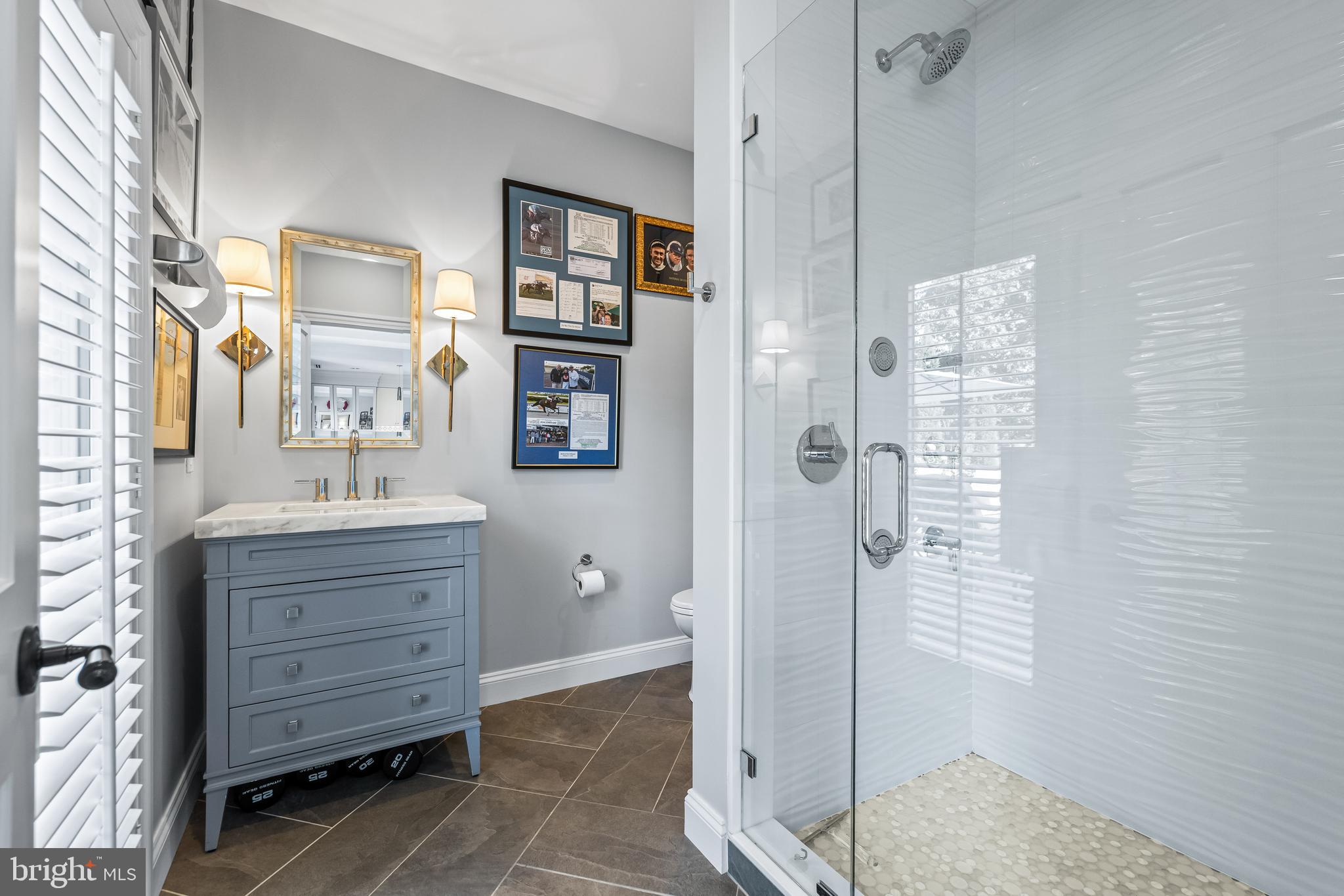 1421 Wine Spring Lane Baltimore, MD 21204 - Photo 122 of 150 a bathroom with a shower a sink and a mirror