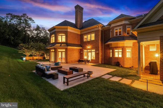 a view of a dining room with furniture a chandelier and wooden floor
