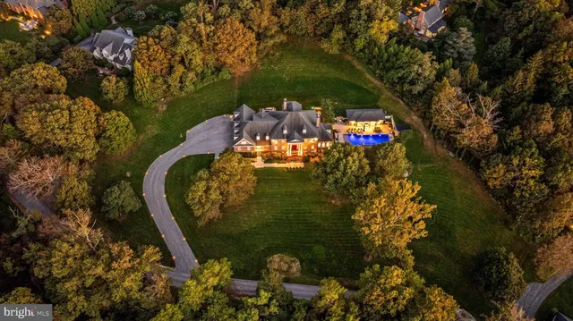 a living room with furniture and a painting on the wall