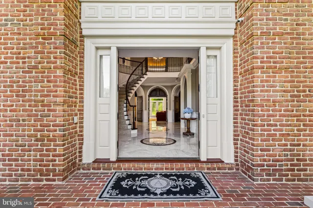a kitchen with stainless steel appliances granite countertop a sink and a granite counter tops with a large window