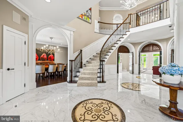 a kitchen with granite countertop white cabinets and two sink