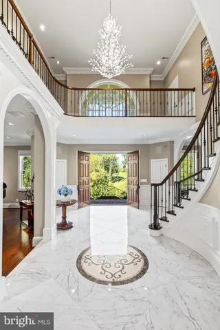 a view of an entrance to house with wooden floor