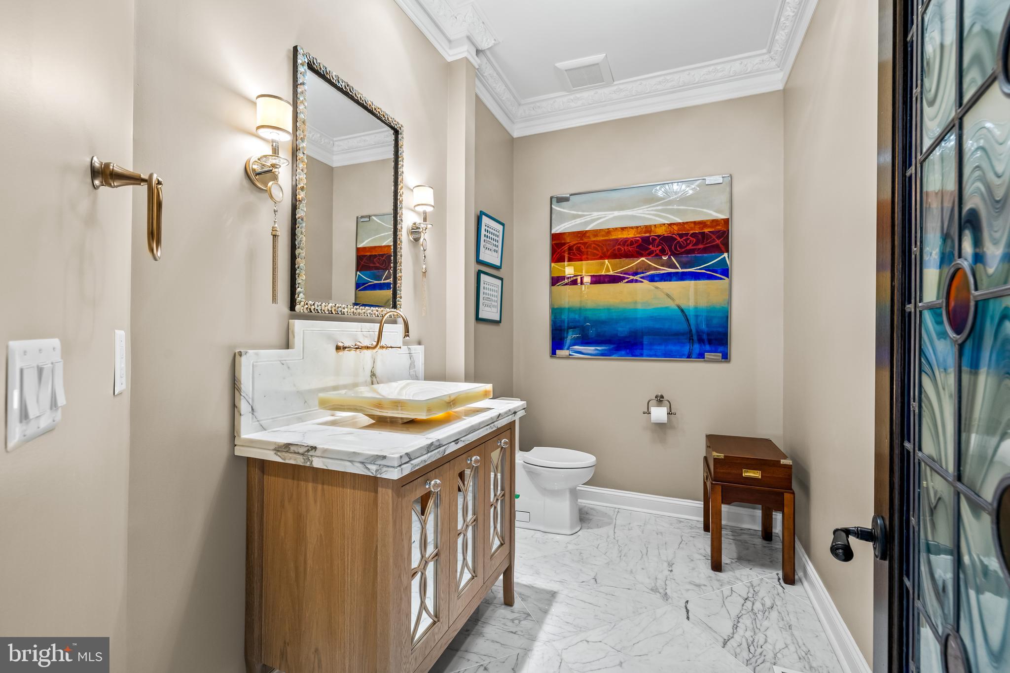 1421 Wine Spring Lane Baltimore, MD 21204 - Photo 29 of 150 a bathroom with a granite countertop sink a toilet and a mirror