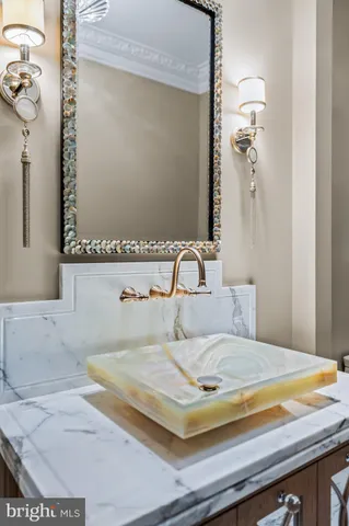 a spacious bathroom with a granite countertop sink mirror and shower