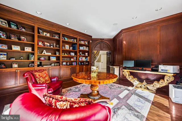 a view of a patio with table and chairs with wooden floor and fence