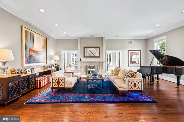 a view of patio with table and chairs under an umbrella