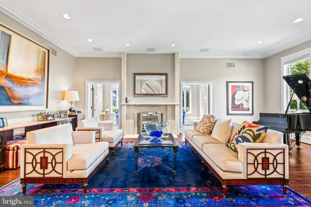 a view of a house with swimming pool and sitting area