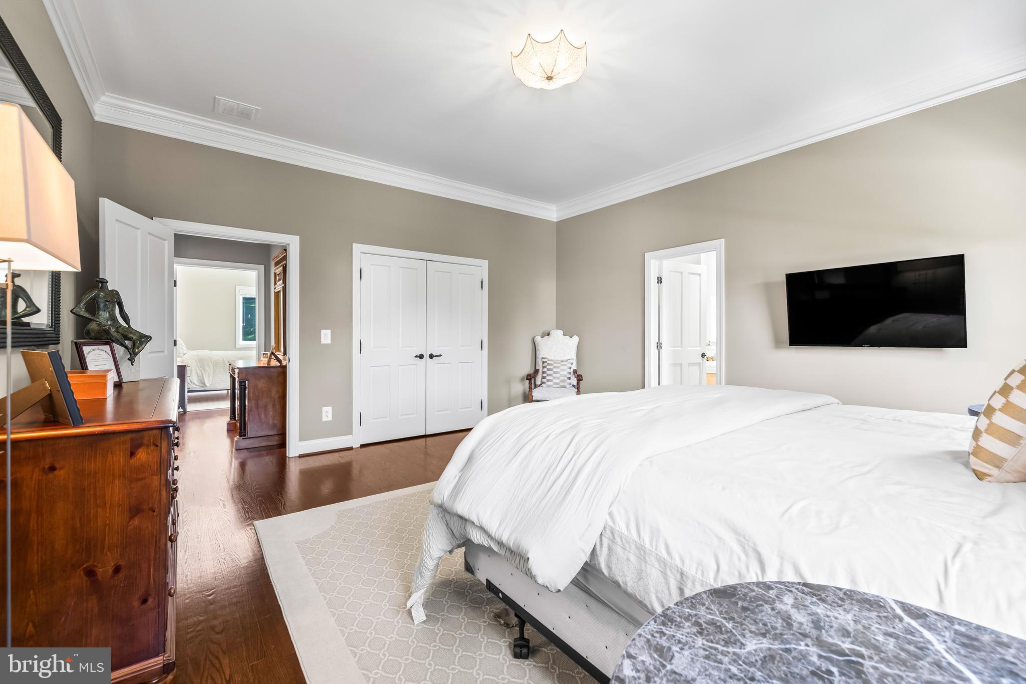 1421 Wine Spring Lane Baltimore, MD 21204 - Photo 95 of 150 a bedroom with a bed and a flat screen tv