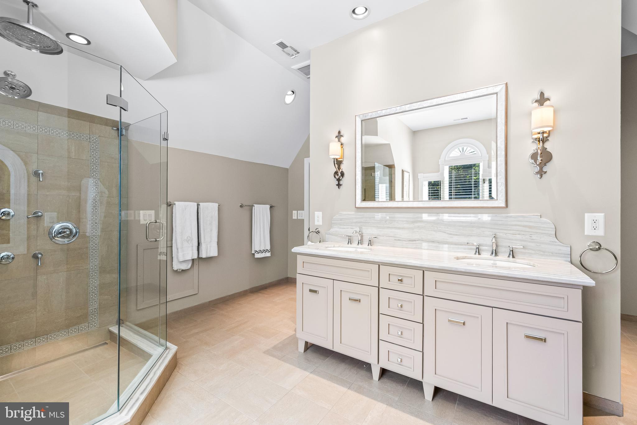 1421 Wine Spring Lane Baltimore, MD 21204 - Photo 97 of 150 a spacious bathroom with a granite countertop sink mirror and shower