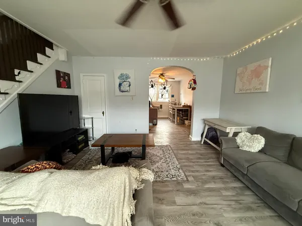a bedroom with furniture and a flat screen tv