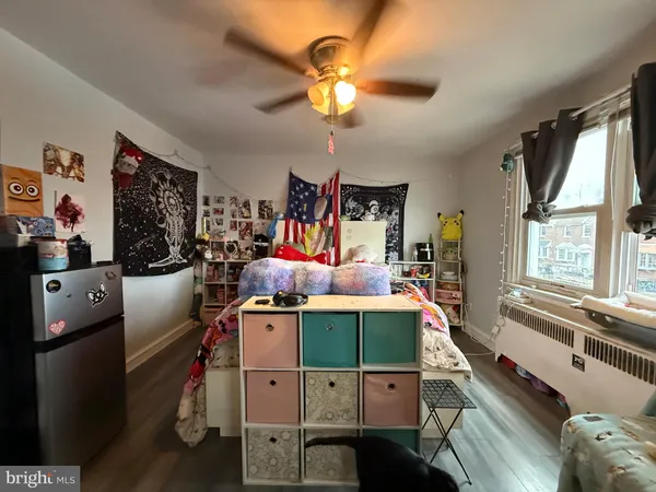 a room with furniture a chandelier and a flat screen tv