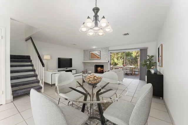a living room with fireplace furniture and a flat screen tv