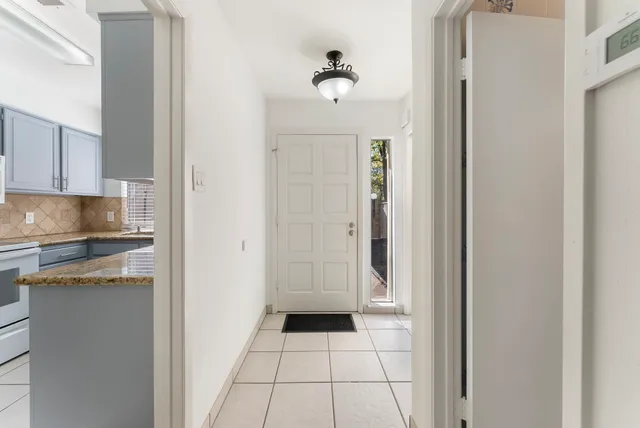 a view of a kitchen from the hallway