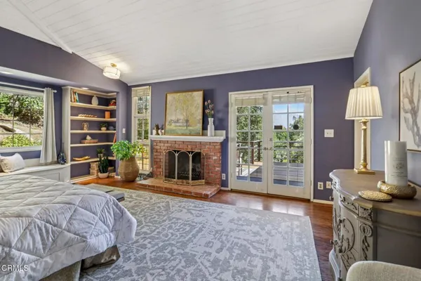 a bed room with a bed and a fireplace