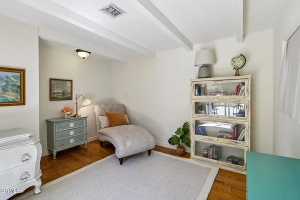 a workspace with furniture and a rug