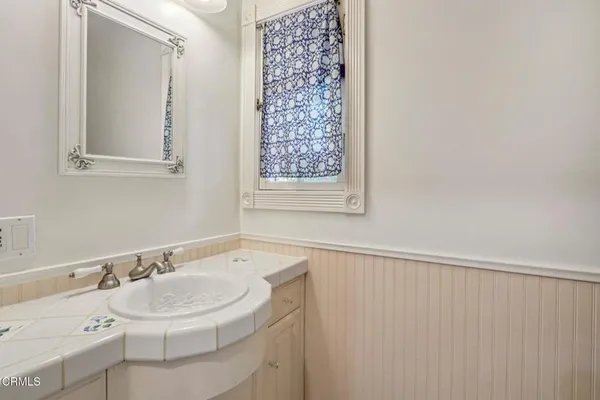 a view of balcony with wooden floor and fence
