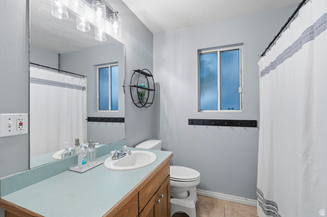 1099 South 950 East, Unit 17 Provo, UT 84606 - Photo 12 of 23 Bathroom vanity with an integrated sink and updated lighting.