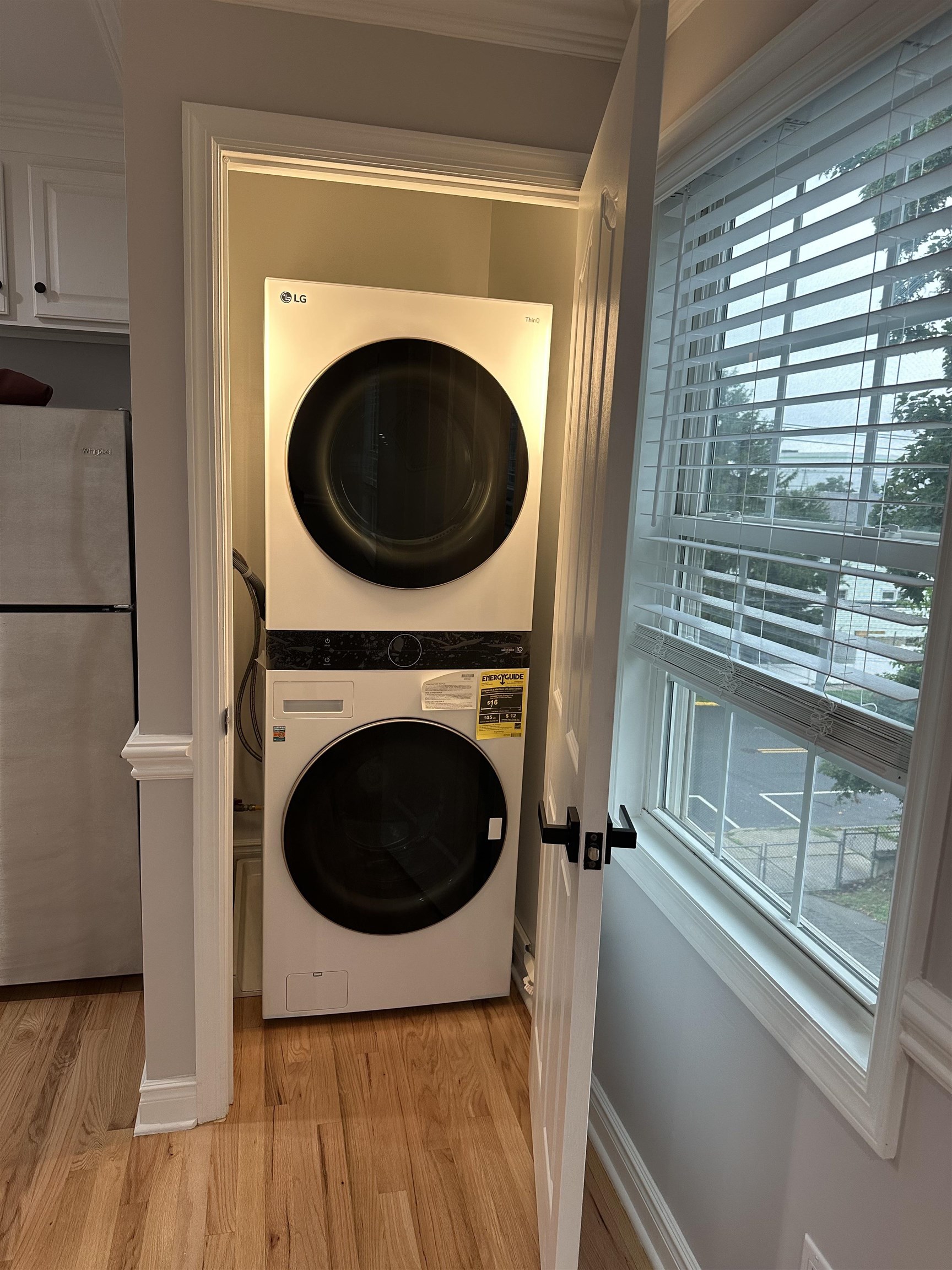 24 New Street, Unit 2 Bayonne, NJ 07002 - Photo 9 of 21 a view of a hallway with washer and dryer