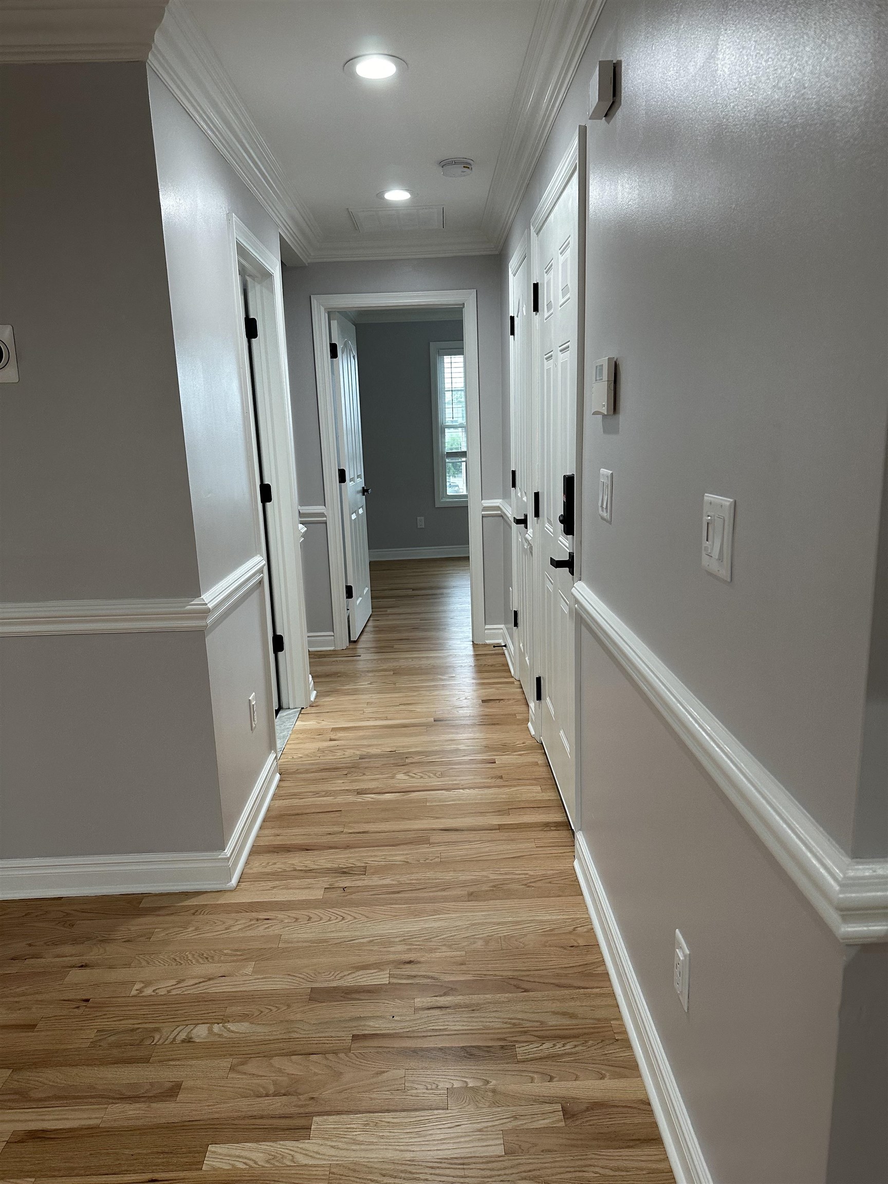 24 New Street, Unit 2 Bayonne, NJ 07002 - Photo 10 of 21 a view of a hallway with wooden floor
