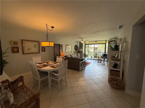a dining room with furniture and wooden floor