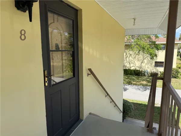 a view of a street with a building in the background