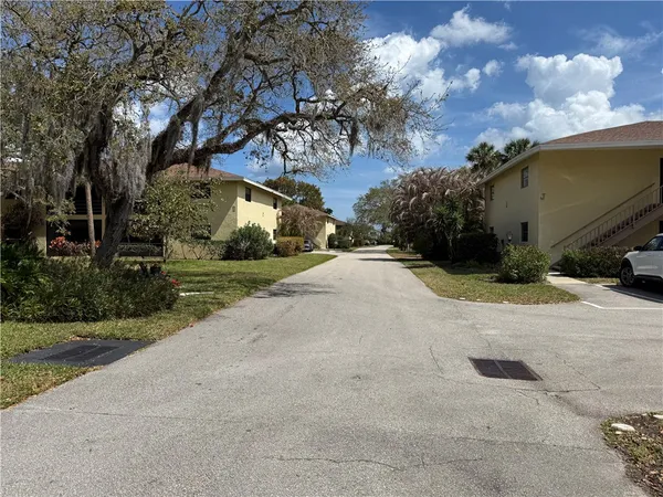a view of yard with swimming pool and green space