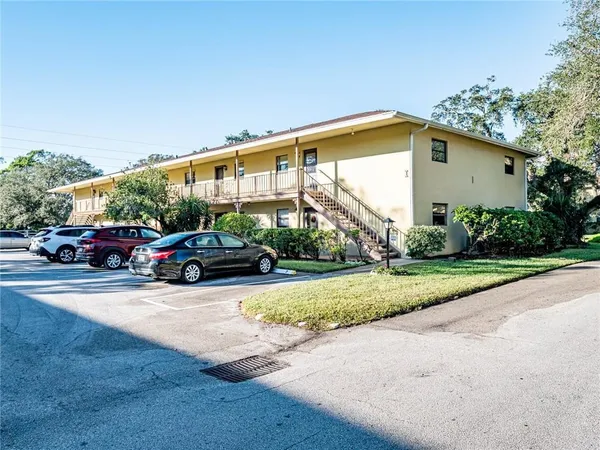 a view of street with parked cars