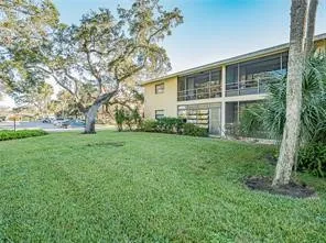 a view of house with yard