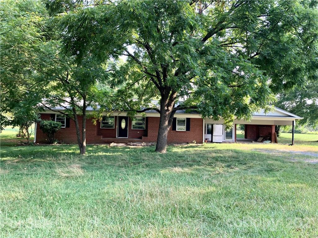 205 Trinity Church Road Monroe, NC 28112 - Photo 1 of 1 a house view with a outdoor space