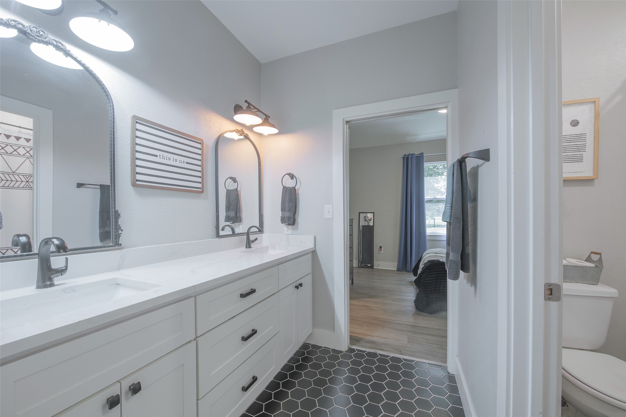 28406 Riley Road Waller, TX 77484 - Photo 17 of 31 Two bedrooms share this Jack-and-Jill bath, complete with a generous double vanity and a private water closet—making mornings a little easier for everyone.