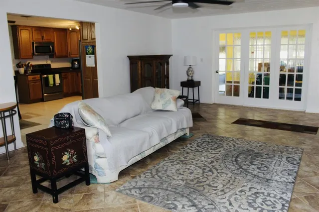 a living room with furniture and a fireplace