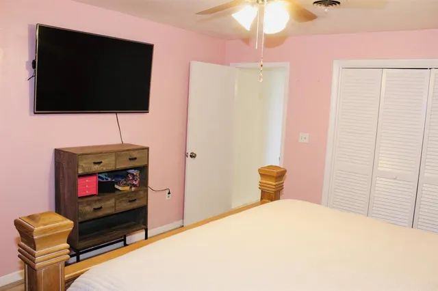 a living room with a flat screen tv and a fireplace