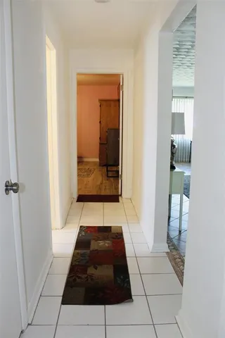 a room with a rug and a rug