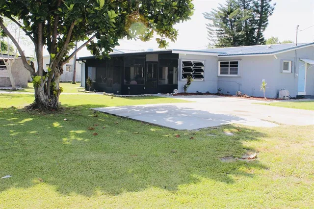 a house with swimming pool in front of it