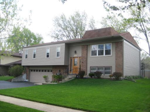 363 Galahad Road Bolingbrook, IL 60440 - Photo 1 of 1 a view of a house with a yard and a large tree