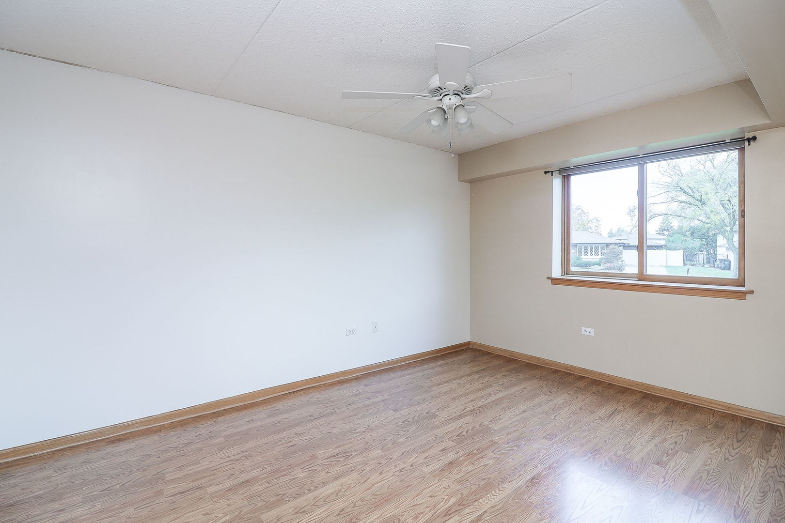 18100 Rita Road, Unit 1B Tinley Park, IL 60477 - Photo 14 of 21 a view of an empty room with a window