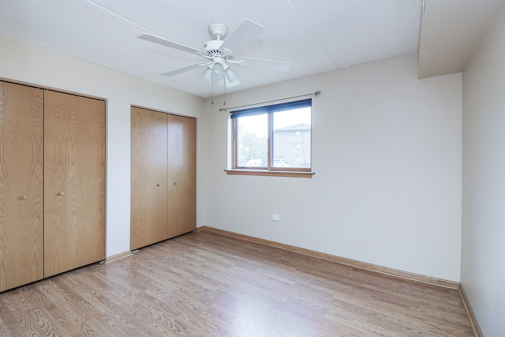 18100 Rita Road, Unit 1B Tinley Park, IL 60477 - Photo 16 of 21 a view of an empty room with a window