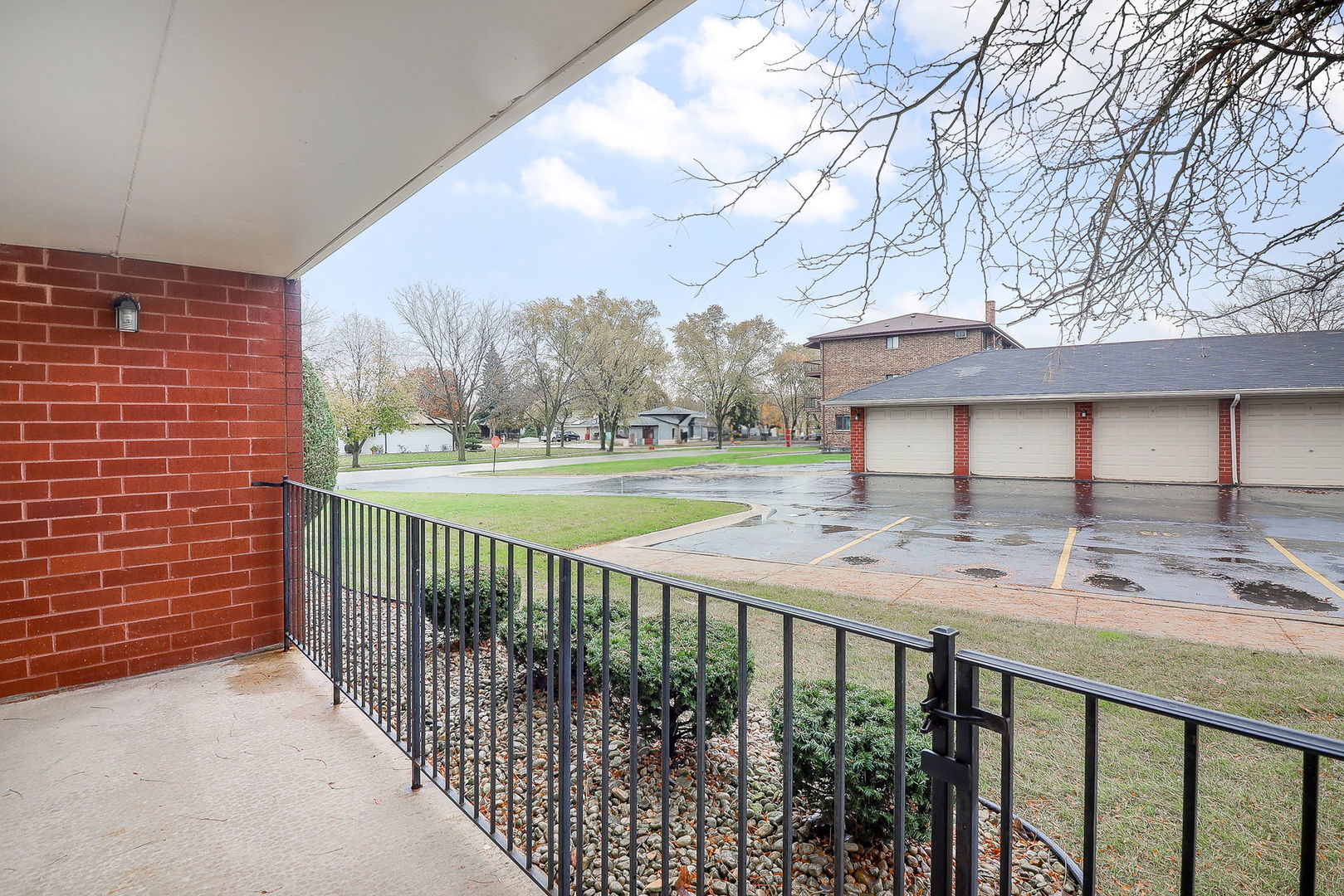 18100 Rita Road, Unit 1B Tinley Park, IL 60477 - Photo 19 of 21 a view of a balcony with wooden floor and fence