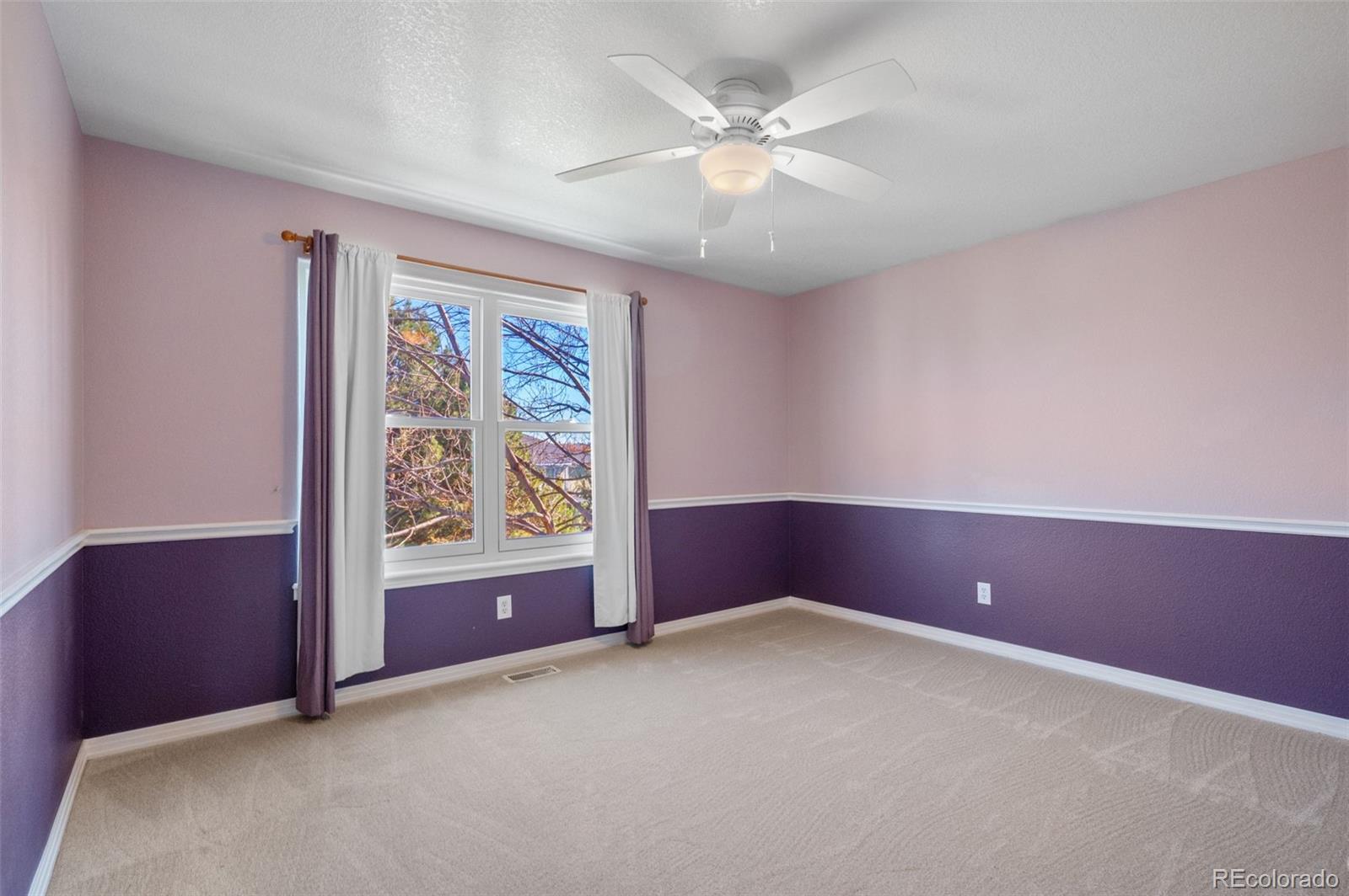 1356 Northpark Drive Lafayette, CO 80026 - Photo 21 of 35 an empty room with windows and fan