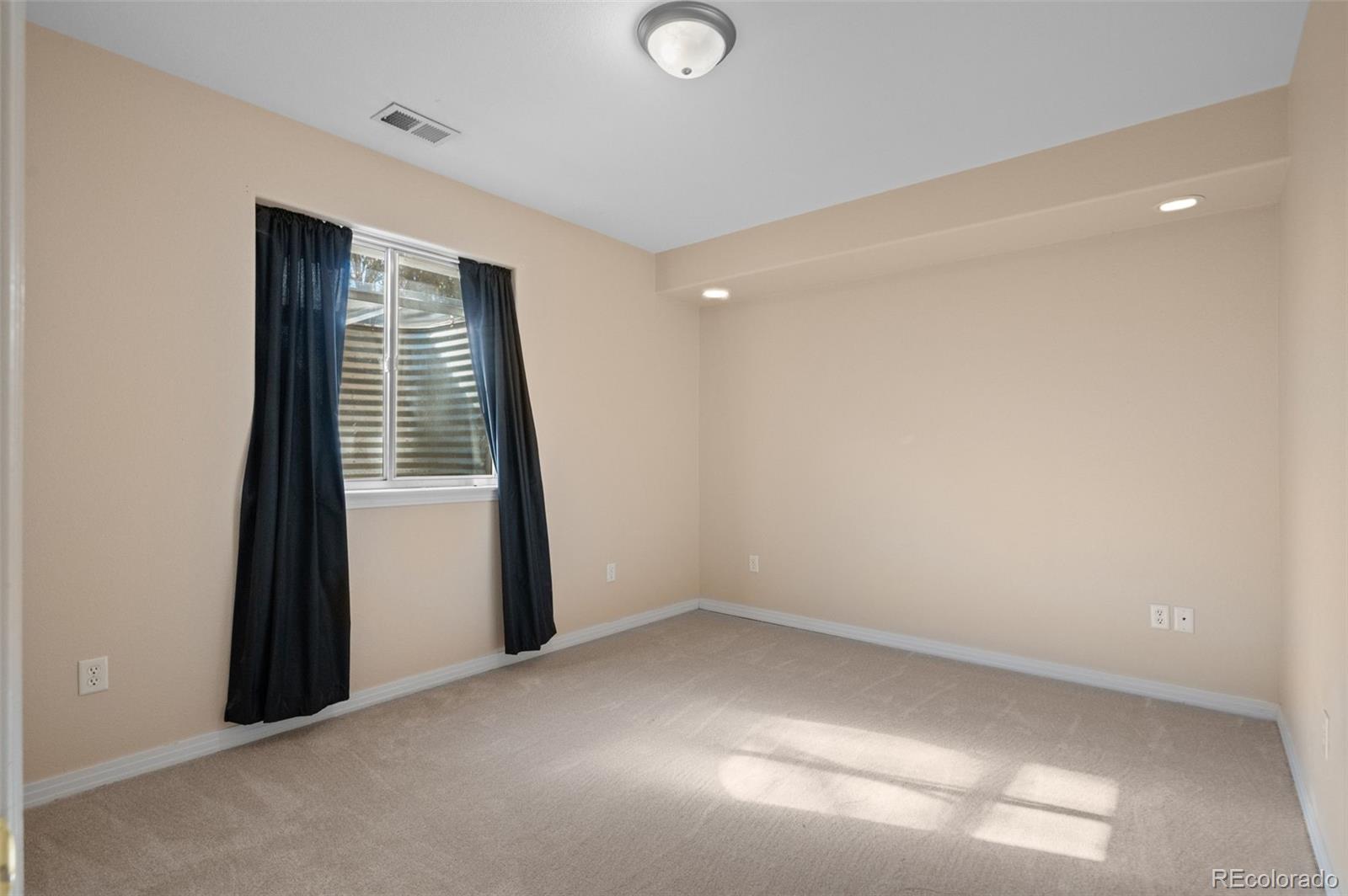 1356 Northpark Drive Lafayette, CO 80026 - Photo 24 of 35 an empty room with windows