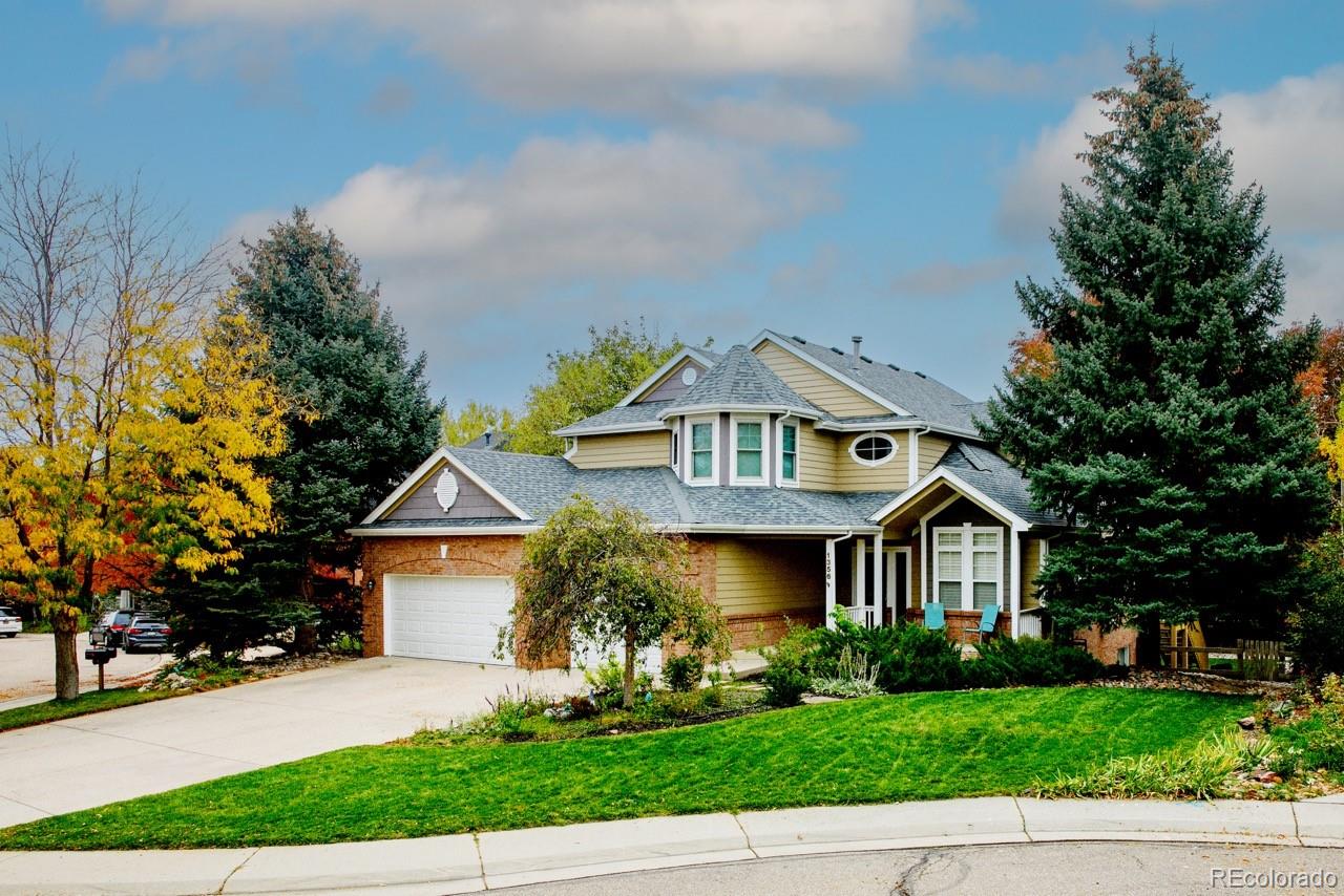 1356 Northpark Drive Lafayette, CO 80026 - Photo 3 of 35 a front view of a house with a yard