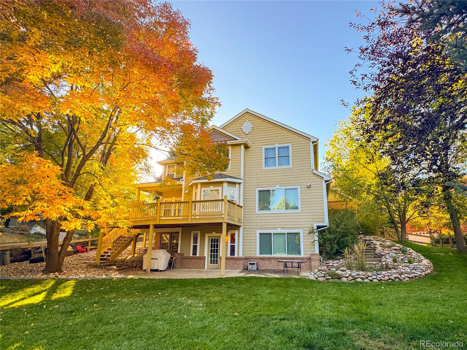 1356 Northpark Drive Lafayette, CO 80026 - Photo 4 of 35 front view of a house with a yard