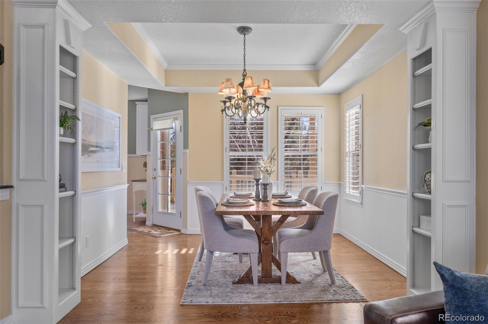 1356 Northpark Drive Lafayette, CO 80026 - Photo 7 of 35 a view of a dining room with furniture window and wooden floor