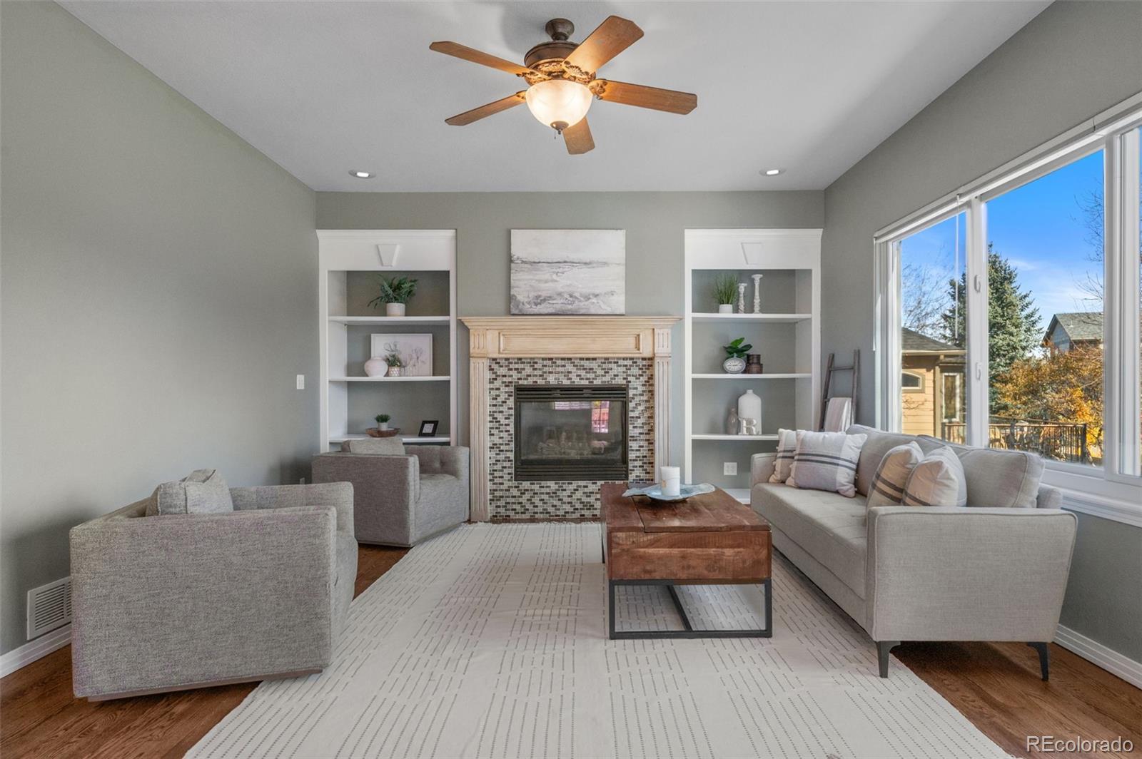 1356 Northpark Drive Lafayette, CO 80026 - Photo 9 of 35 a living room with furniture and a fireplace