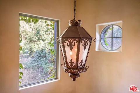 a spacious bedroom with a bed and a fireplace