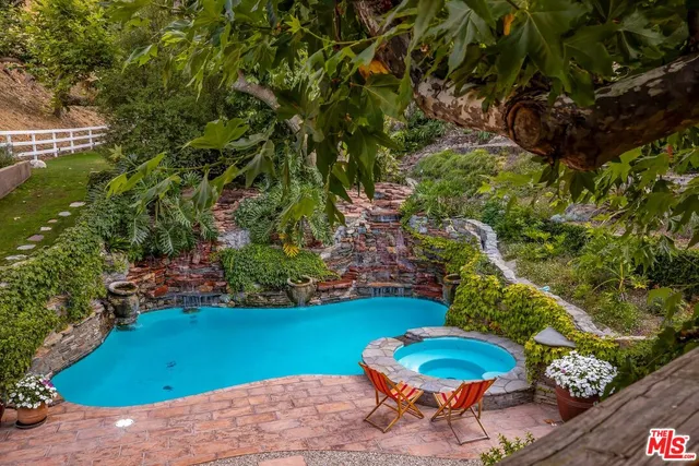 a bath tub sitting next to a bathroom sink