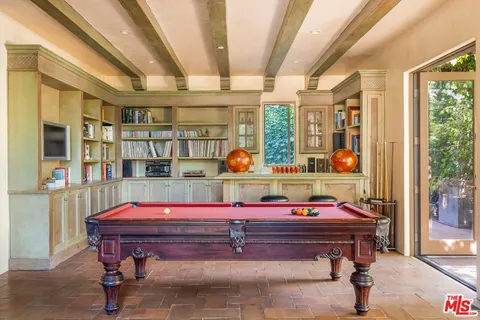 a view of a dining room with furniture wooden floor and chandelier