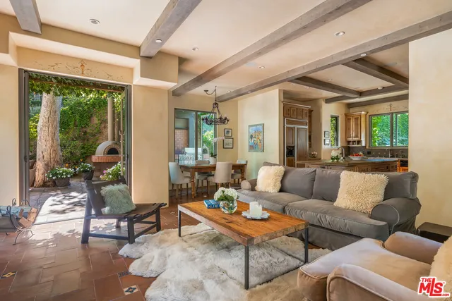 a kitchen with stainless steel appliances granite countertop a stove and a refrigerator