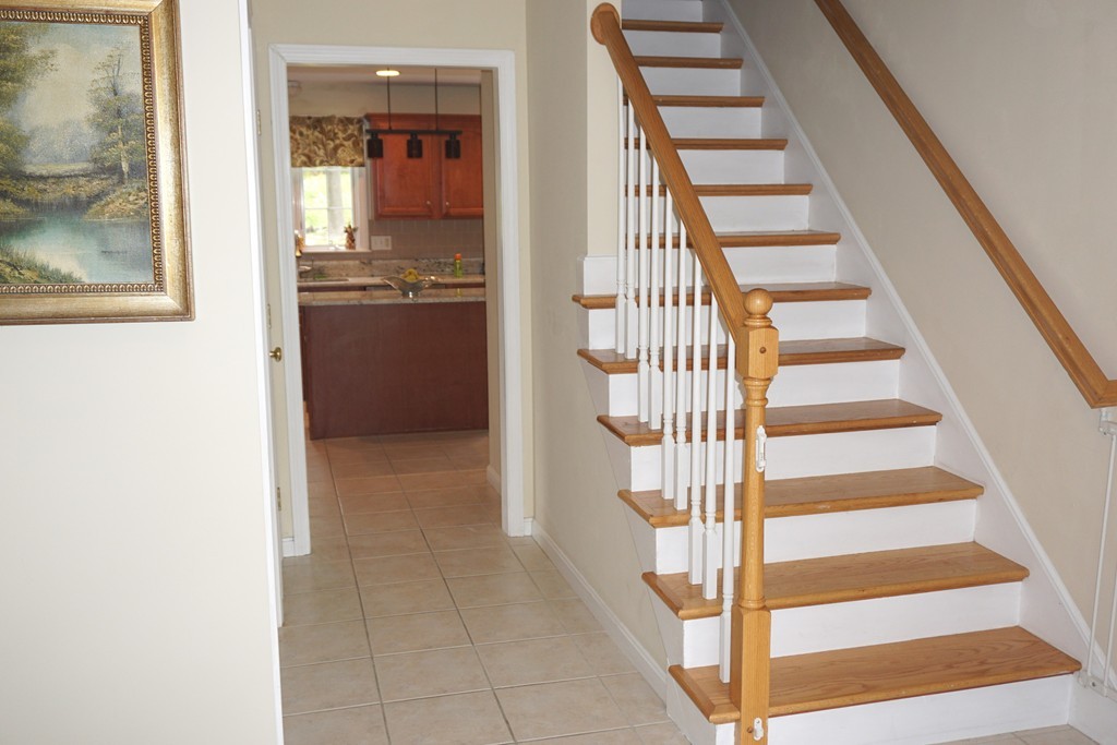 84 Fairview Park Road Sturbridge, MA 01566 - Photo 13 of 30 a view of staircase with white walls and a window