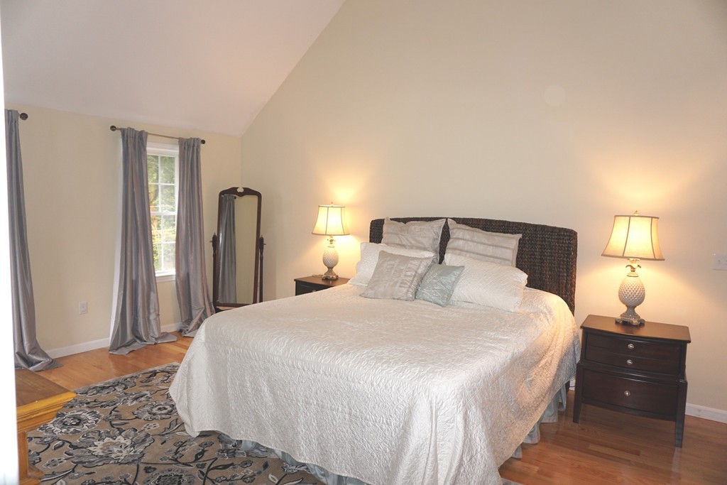 84 Fairview Park Road Sturbridge, MA 01566 - Photo 14 of 30 a bedroom with a bed and wooden floor
